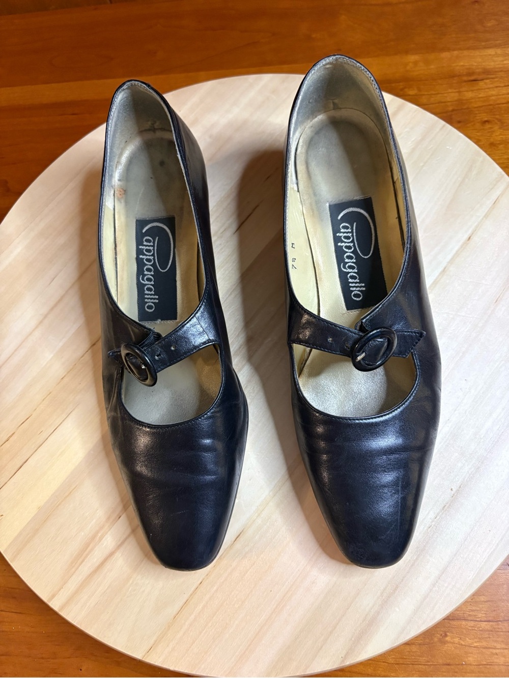 vintage black leather Pappagallo Mary Jane heels with a rounded buckle strap.